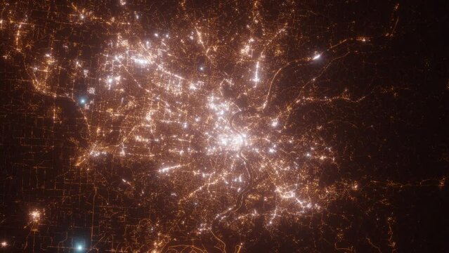 Cincinnati (Ohio, USA) top view at night. Top view on modern city with street lights and glow effect. Camera is zooming in, rotating clockwise. Vertical video. The north is on the left side