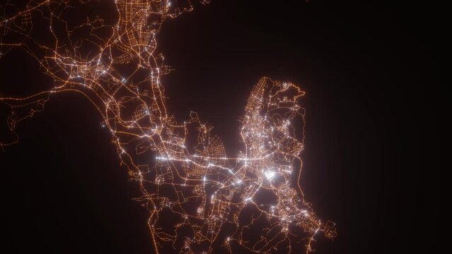 Dalian (China) aerial view at night. Top view on modern city with street lights. Camera is zooming out, rotating clockwise. Vertical video. The north is on the left side