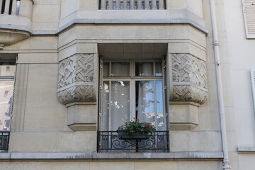 Fototapeta na wymiar Art Deco building facades, geometric decorations, ornaments and more. Architecture from the beginning of the 20th century. Shot in Paris.