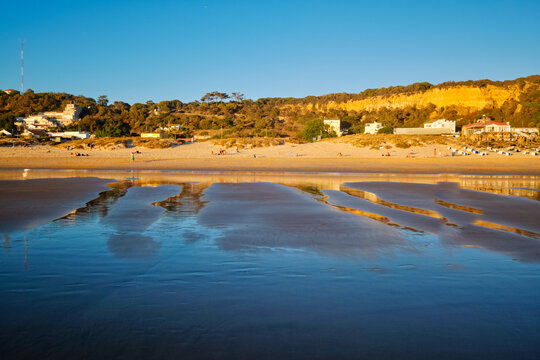 Atlantic ocean sunset with surging waves at Fonte da Telha beach, Costa da Caparica, Portugal
