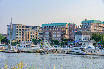 Stamford, Connecticut, United States. August 07 2023. Buildings, people, streets with cars and shops in the surroundings. Sunday.