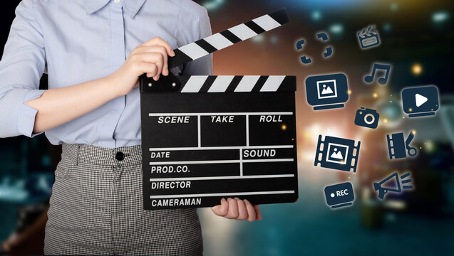 Woman holding Clapperboard or movie slate use in video production ,film, cinema industry.