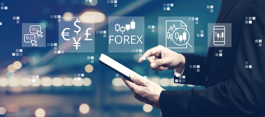 Forex trading concept with businessman using a tablet computer - obrazy, fototapety, plakaty