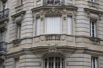 Fancy ornament details and decorations shot on Paris building facades. Doors and windows surround, decorated balconies.