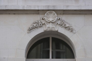 Fancy ornament details and decorations shot on Paris building facades. Doors and windows surround, decorated balconies.