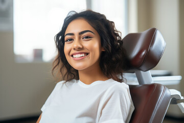Smiling Mexican woman in dental chair