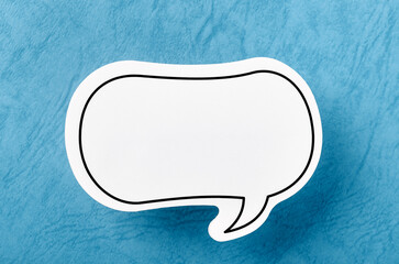 The Speech bubble with copy space communication talking speaking concepts on blue background.