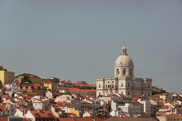 Beautiful view of rooftops in Lisbon, Portugal on a sunny day with space for text. National Pantheon set amongst the vibrant orange rooftops. - 634376309