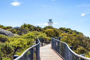 Cape Tourville Lighthouse in Freycinet National Park, in Close Bay, Tasmania, Australia. Summer blue sky background.