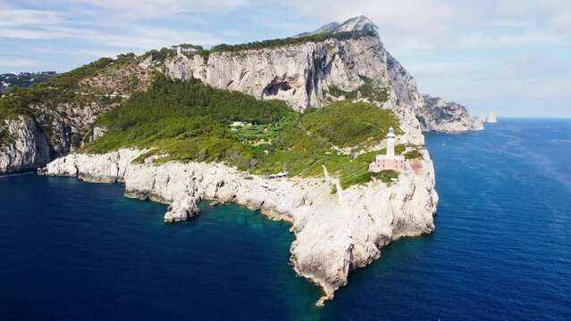 Amazing aerial view of Capri coastline along the lighthouse in summer season