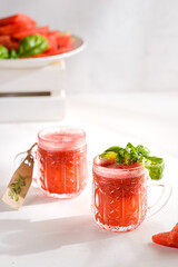 watermelon shake with basil on a white background