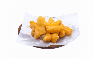    deep - fried dough stick in wooden plate on white background(isolated) close up