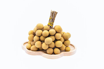 fresh pile of Longan in wooden plate on white background closeup,isolate