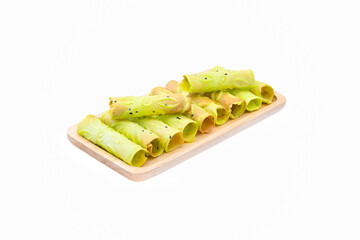  Thai Crispy golden curl pandan flavor( thong muan ) in wooden plate on white background close up,isolated