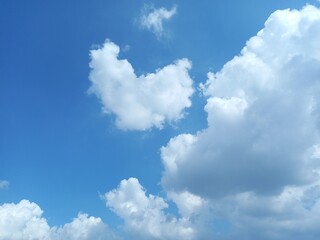 Clouds forming in a clear blue sky. bright natural scenery.