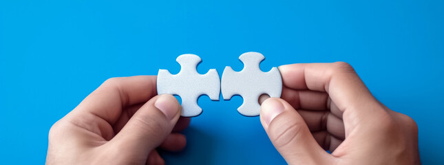 Close-up shot, a businessman's hand meticulously holds, assembles jigsaw puzzle, symbolizing collaborative spirit strategic synergy that drives business success. Generative AI.