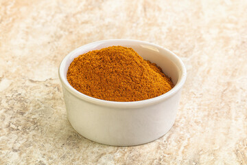 Dry Paprika powder in the bowl