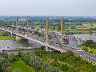 Aerial drone photo of an highway bridge over the river Waal in the Netherlands