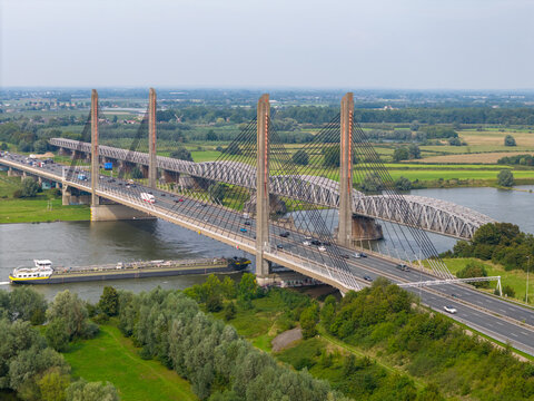 Aerial drone photo of an highway bridge over the river Waal in the Netherlands