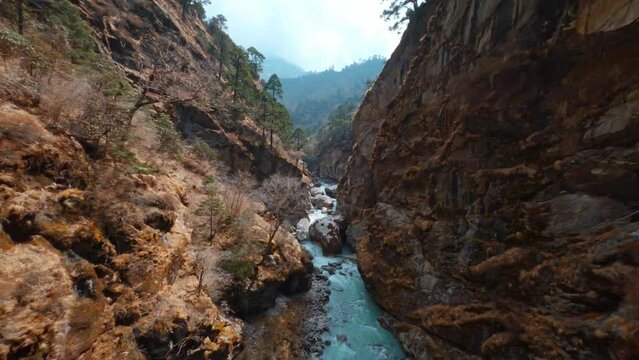 The Glacier River Imja Khola in gorge of Sagarmatha national park in the Himalayas, Nepal. Located near Tengboche, One of the hiking routes to Everest Base Camp.
Shot on fully manual FPV drone