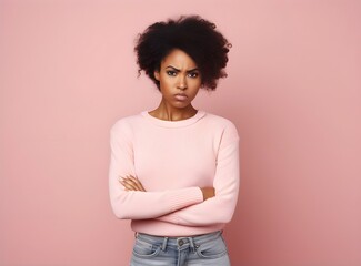 Portrait of a lovely angry young African girl wearing casual clothing standing isolated over pastel pink background, gender fluid, non-binary, arms folded, ethnic, banner, jealous, AI Generated