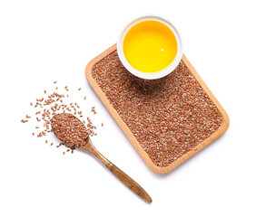 Bowl of flax oil and wooden board with seeds on white background