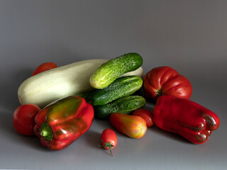 Healthy vegan fresh vegetarian vegetables on a gray background. Vegan food concept. 