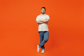 Full body young smiling happy cheerful Indian man he wears white t-shirt casual clothes hold hands...
