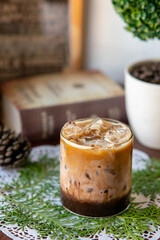 layered coffee on a table with a book background