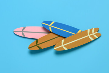 Different mini surfboards on blue background