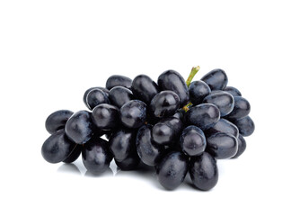 Close up of black grapes on white background