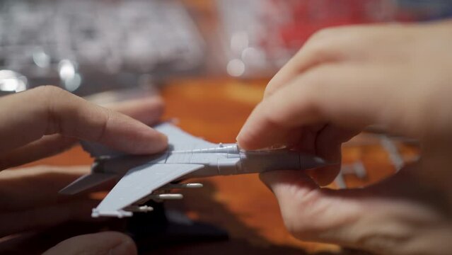 Assembling jet plane plastic model kit