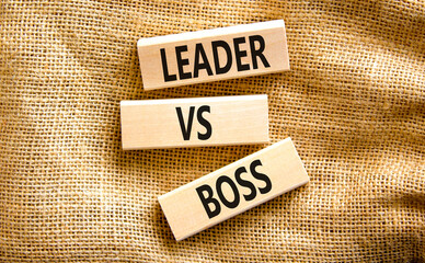 Boss vs leader symbol. Concept words Boss vs versus leader on wooden block. Beautiful canvas table canvas background. Business motivational boss vs leader concept. Copy space.
