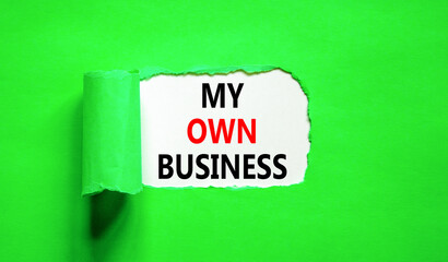My own business symbol. Concept words My own business on beautiful white paper. Beautiful green background. Business motivational my own business concept. Copy space.