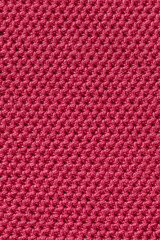 the texture of knitted fabric in bright color 2023 Viva magenta