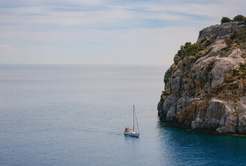 Anthony Quinn bay with crystal clear water and Luxurios yacht in Rhodes island, Greece. The most...