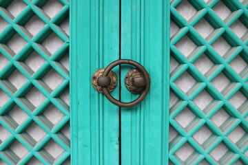 old blue wooden door with handle