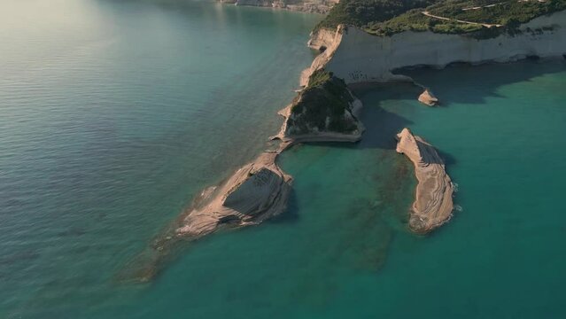 Aerial drone footage of Cape Drastis during the early hours of a sunny morning on Corfu Island