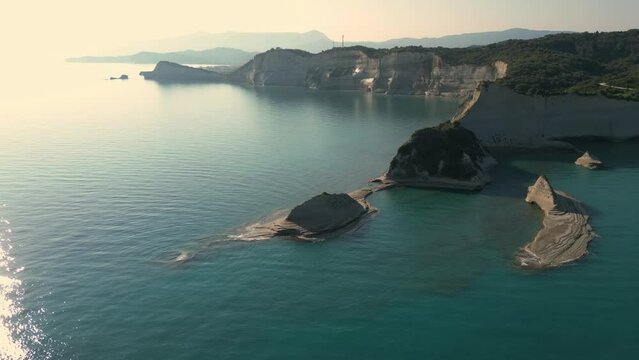 Aerial drone footage of Cape Drastis during the early hours of a sunny morning on Corfu Island