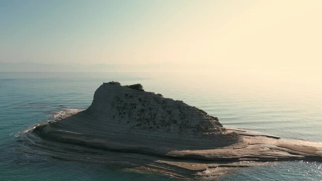 Aerial drone footage of Cape Drastis during the early hours of a sunny morning on Corfu Island