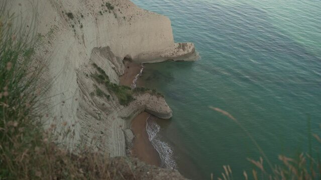 Aerial drone footage of Cape Drastis during the early hours of a sunny morning on Corfu Island