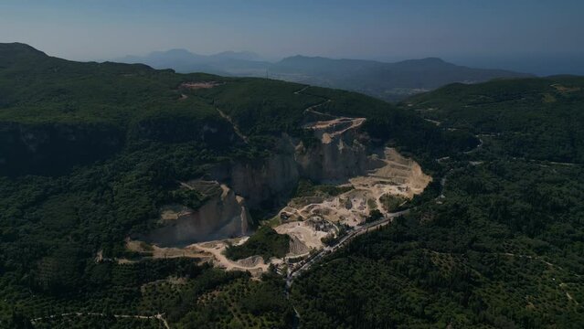 Aerial footage of the limestone quarry at Troumpeta Pass in the Arakli mountain range of NW Corfu