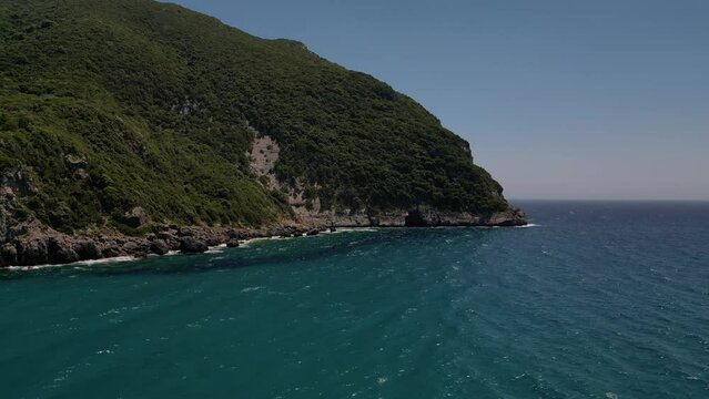 Aerial footage of cliffs next to Paralia Ermones Beach 