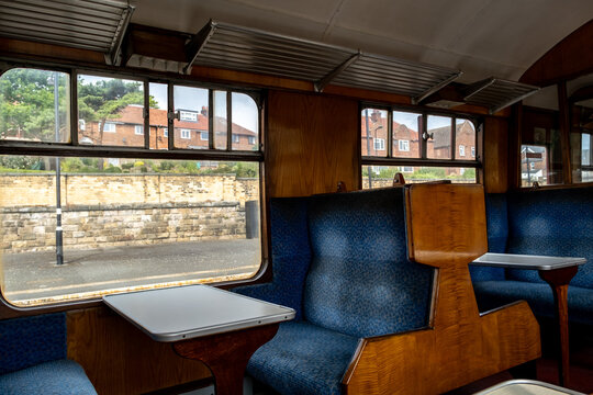 The interior of a traditional railway carriage on the North York Moors Railway