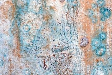 A old grunge metal texture background with rusty metal surface cracked paint caused by corrosive chemicals.