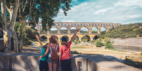 mother and children enjoying le Pont du Gard- Famous attraction in France