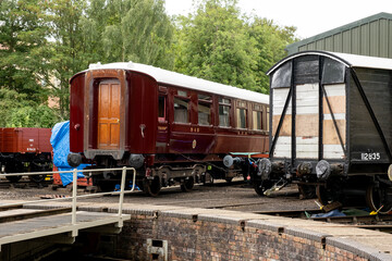 Traditional passenger carriages in a railway shunting yard