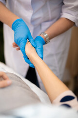 Fototapeta na wymiar close-up of a massage therapist doing a hand massage in a beauty salon
