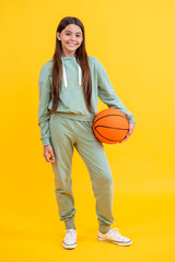 teen girl childhood with basketball. teen girl play with ball. basketball in childhood. Learning basketball at teen girl childhood. Childhood memories of playing basketball. Competitive teen athlete