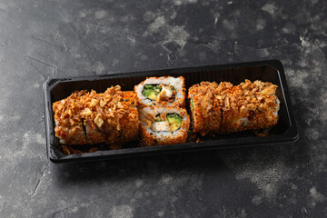 Spicy Sushi roll with prawn, avocado, cucumber. Take away food .